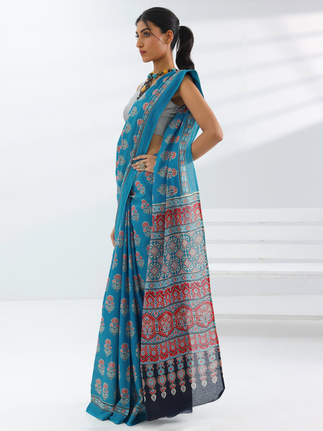 Turquoise Blue Printed Cotton Saree With Unstitched Blouse Piece