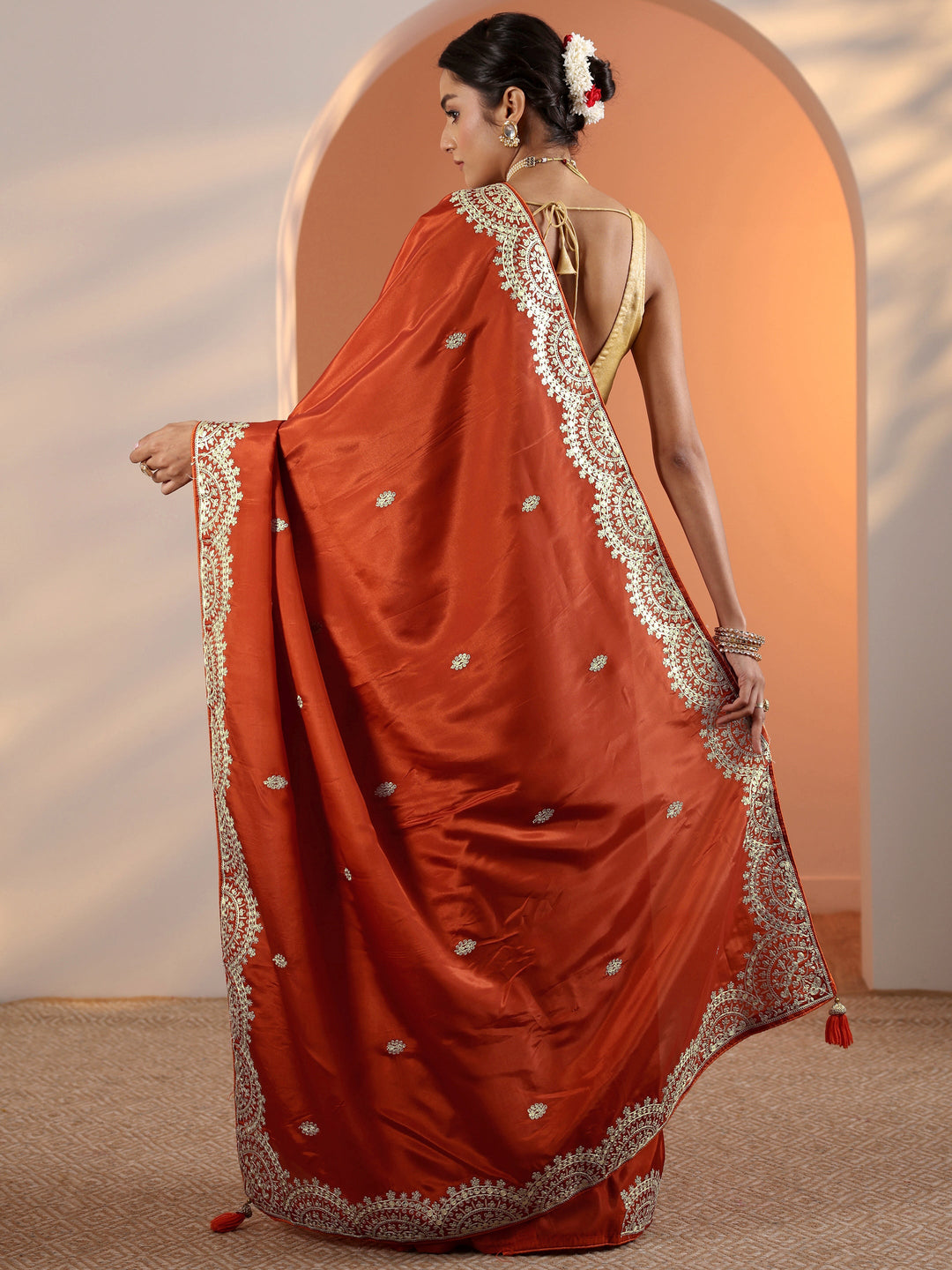 Rust Embellished Crepe Saree With Unstitched Blouse Piece