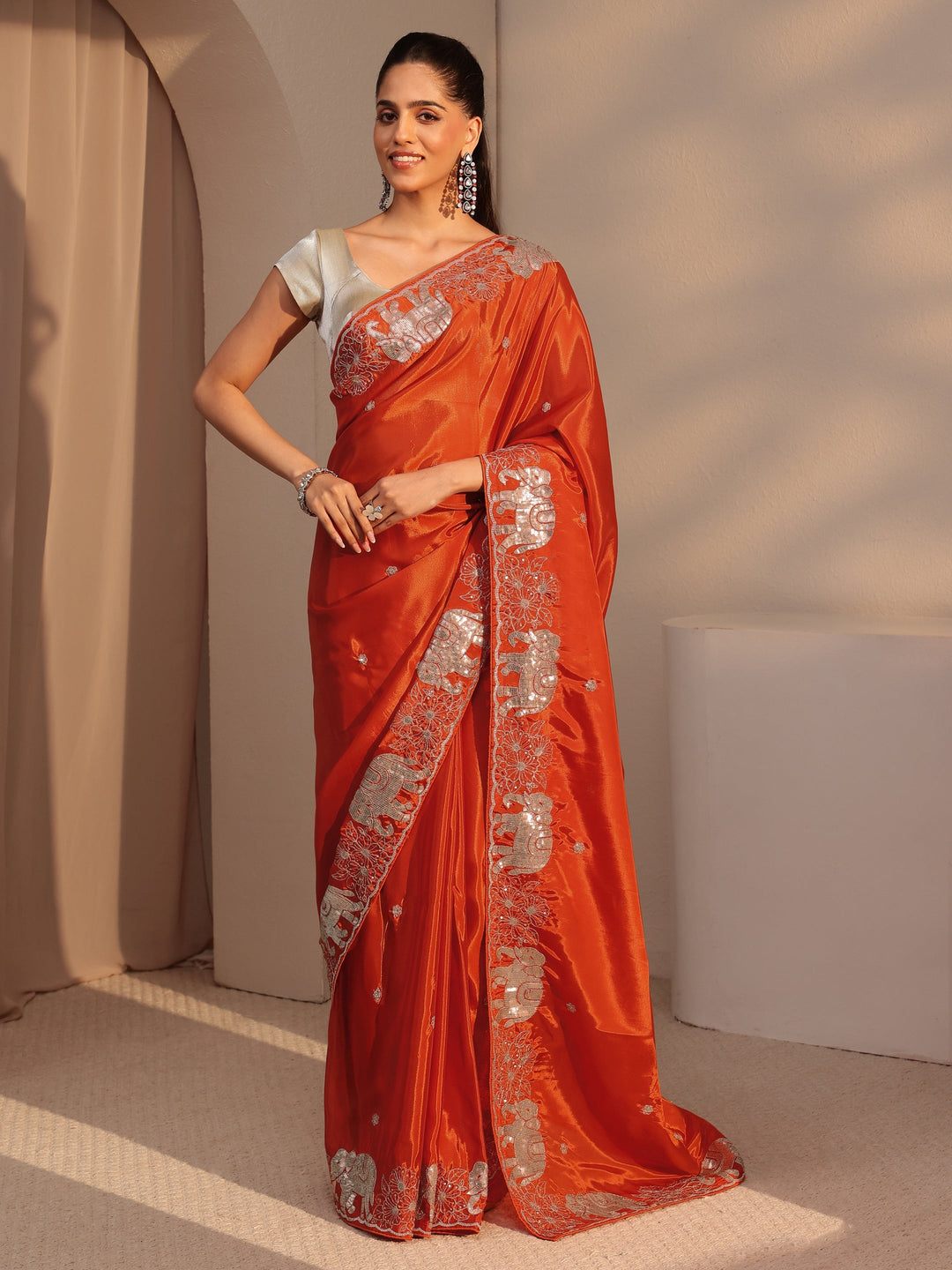 Libas Orange Embellished Satin Saree with Gaja Motif Border