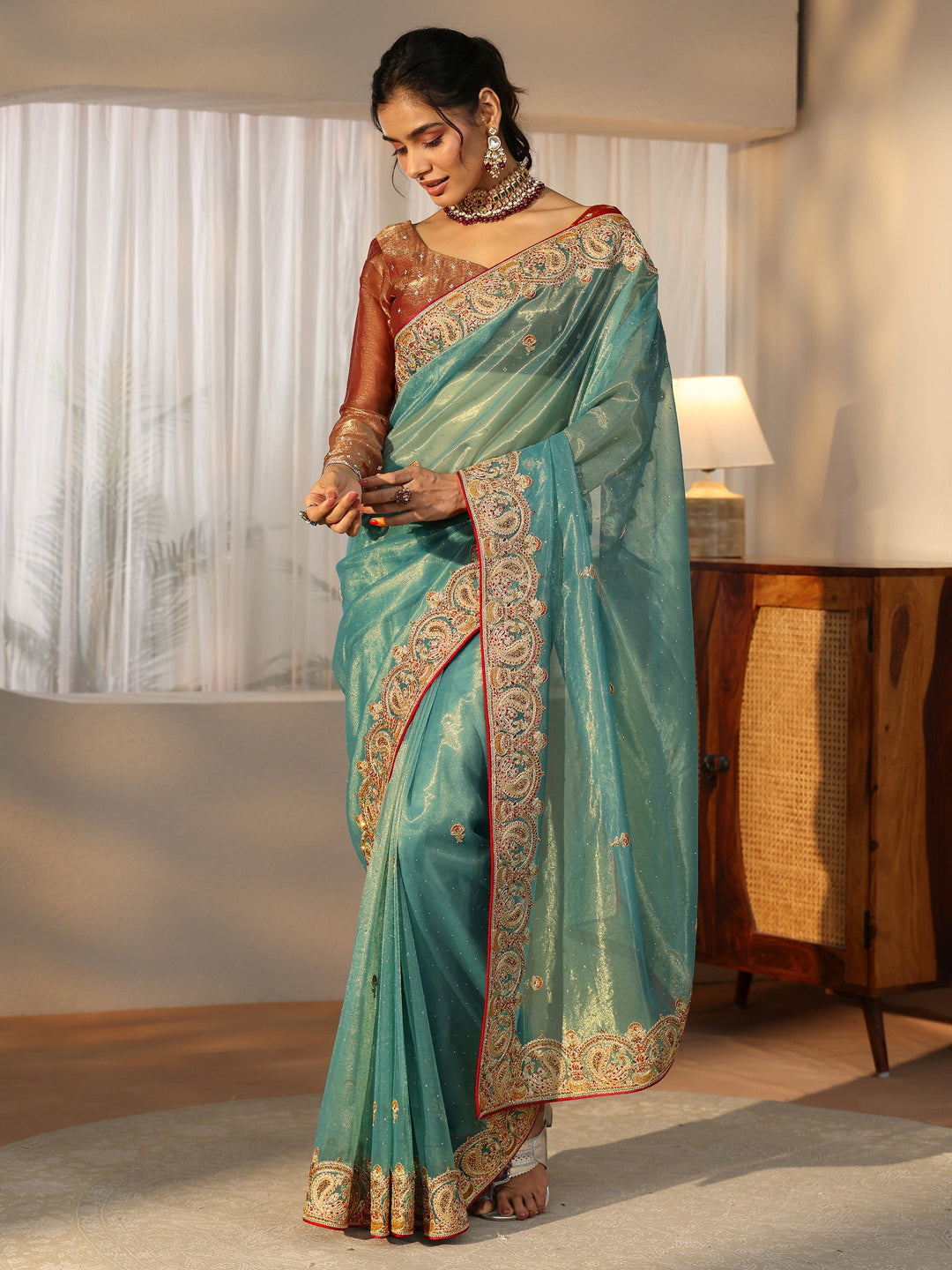 Libas Aqua Blue Net Saree with Embellished Paisley Border