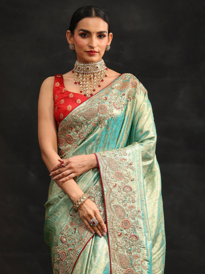 Libas Aqua Blue Woven Design Satin Saree with Embellished Border