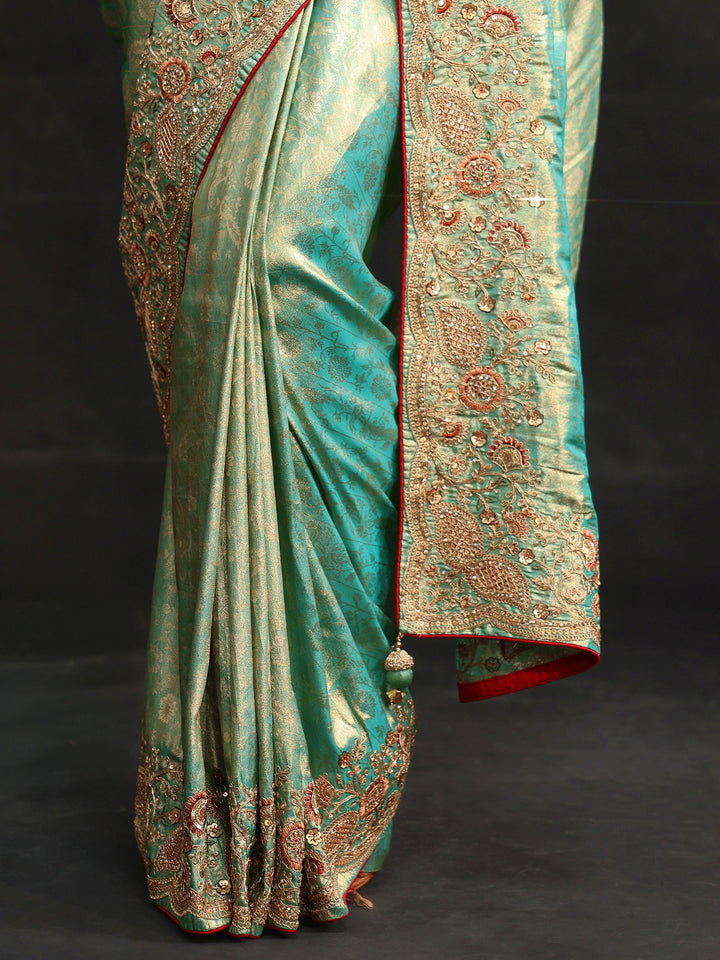 Libas Aqua Blue Woven Design Satin Saree with Embellished Border