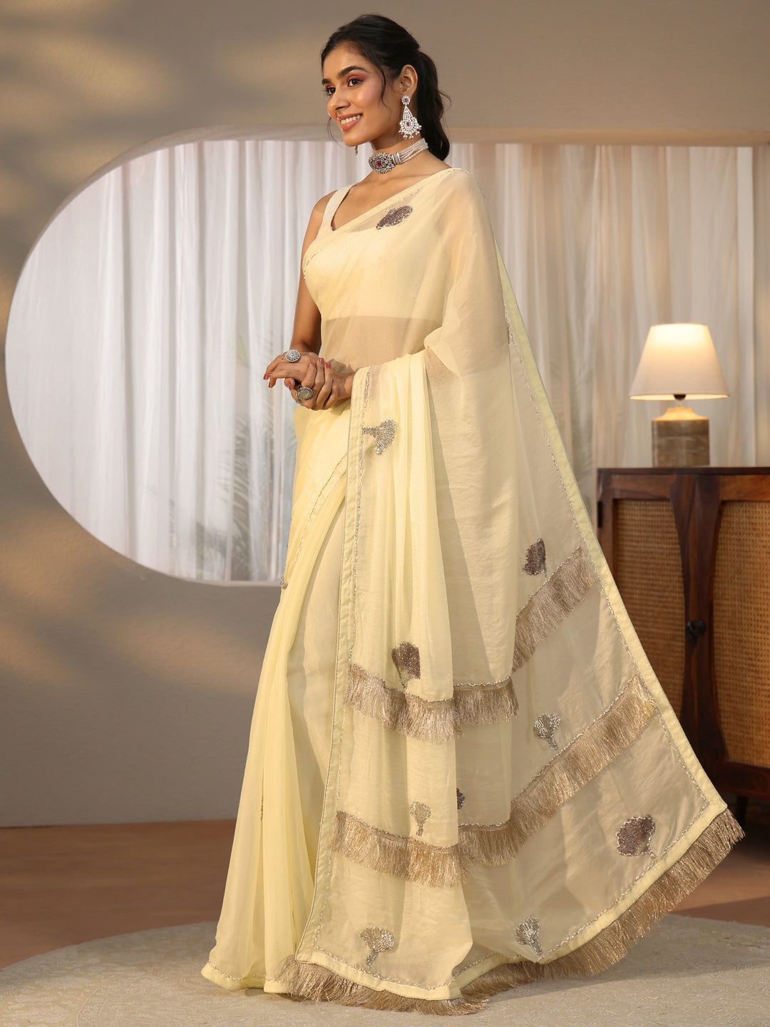 Libas Light Yellow Tissue Saree with Tassel Embellished Pallu