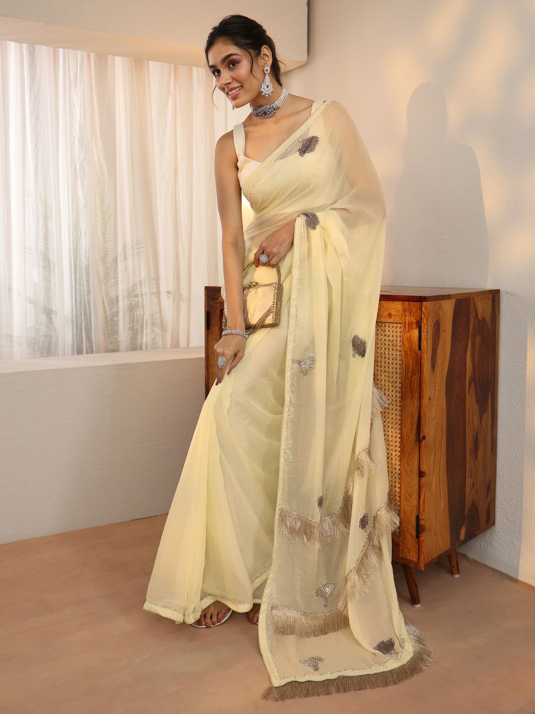 Libas Light Yellow Tissue Saree with Tassel Embellished Pallu