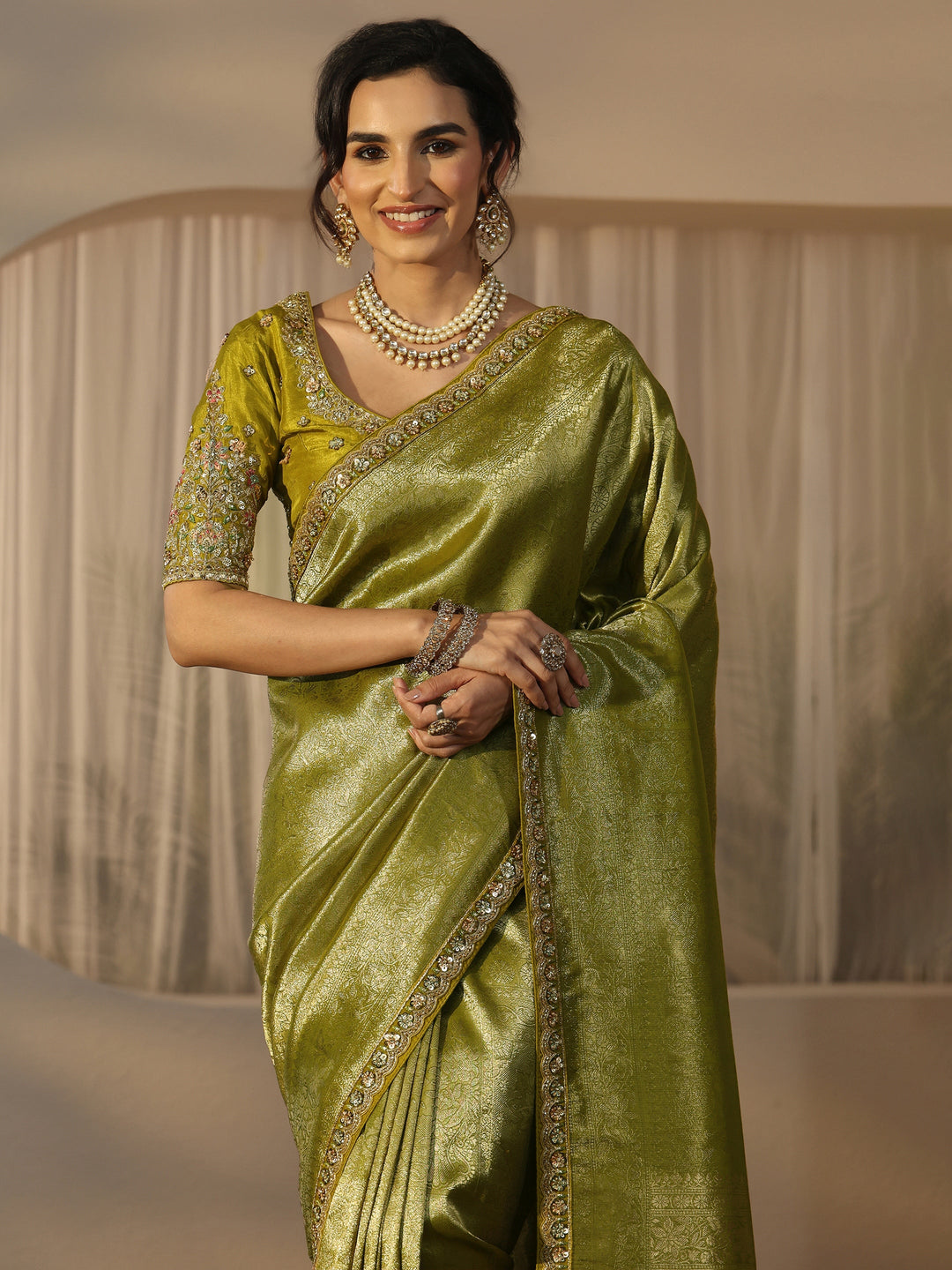 Libas Art Green Textured Silk Blend Saree with Embellished Border