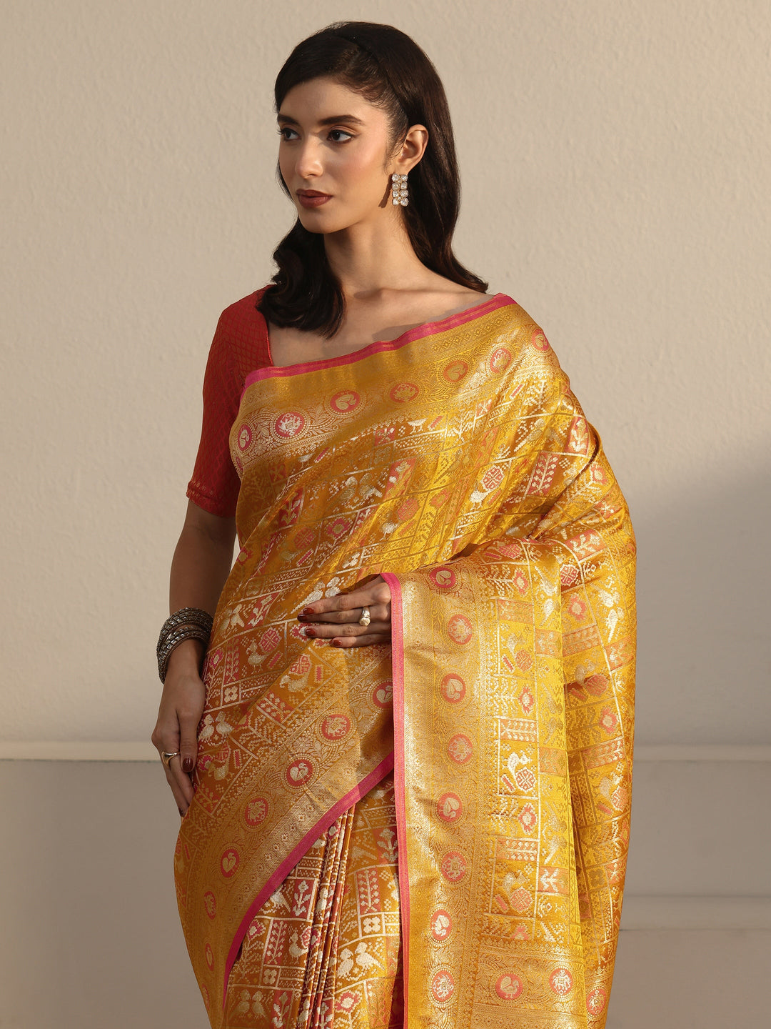 Libas Art Mustard Patola Woven Design Silk Blend Tassel Saree