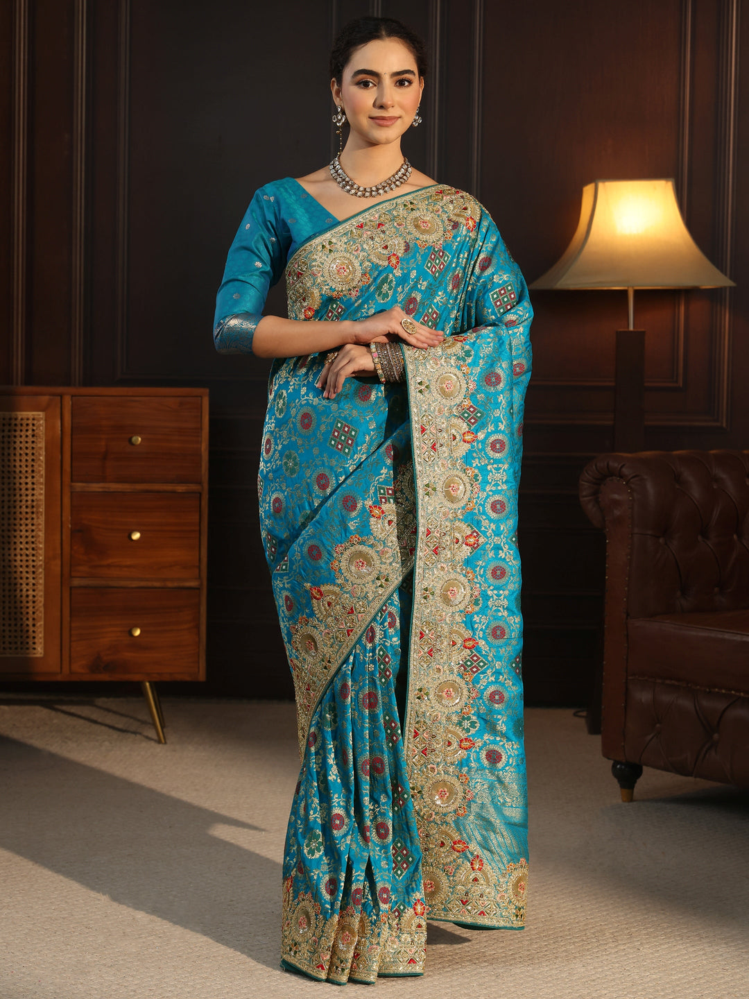 Libas Art Turquoise Woven Design Silk Blend Saree with Embellished Border
