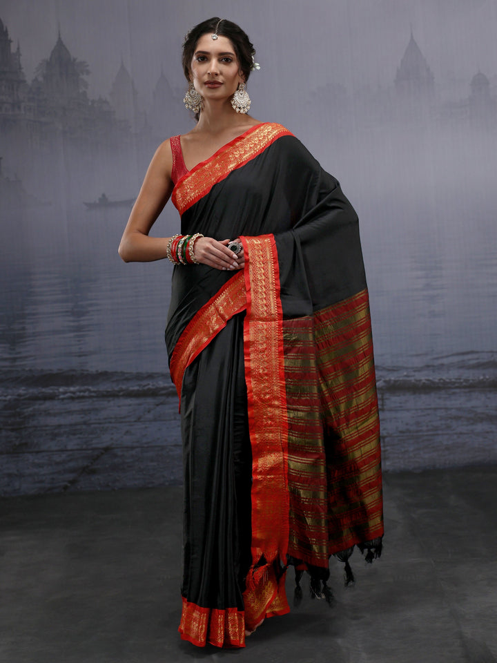 Libas Black and Orange Silk Blend Tassel Saree with Woven Border