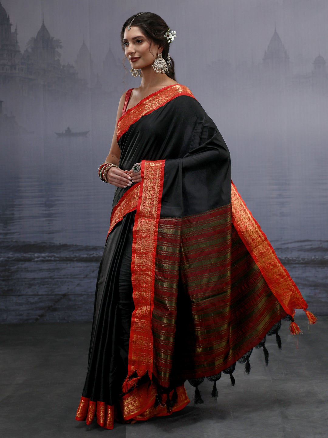 Libas Black and Orange Silk Blend Tassel Saree with Woven Border