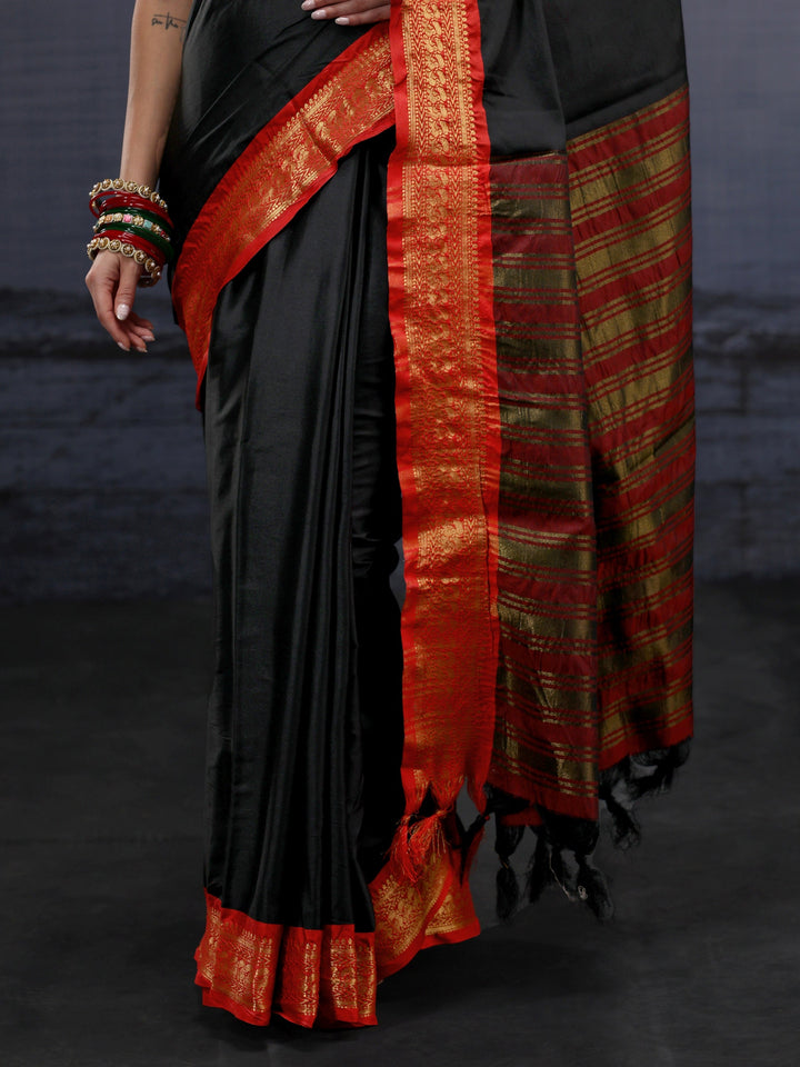 Libas Black and Orange Silk Blend Tassel Saree with Woven Border