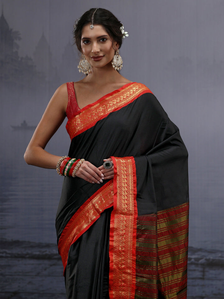Libas Black and Orange Silk Blend Tassel Saree with Woven Border