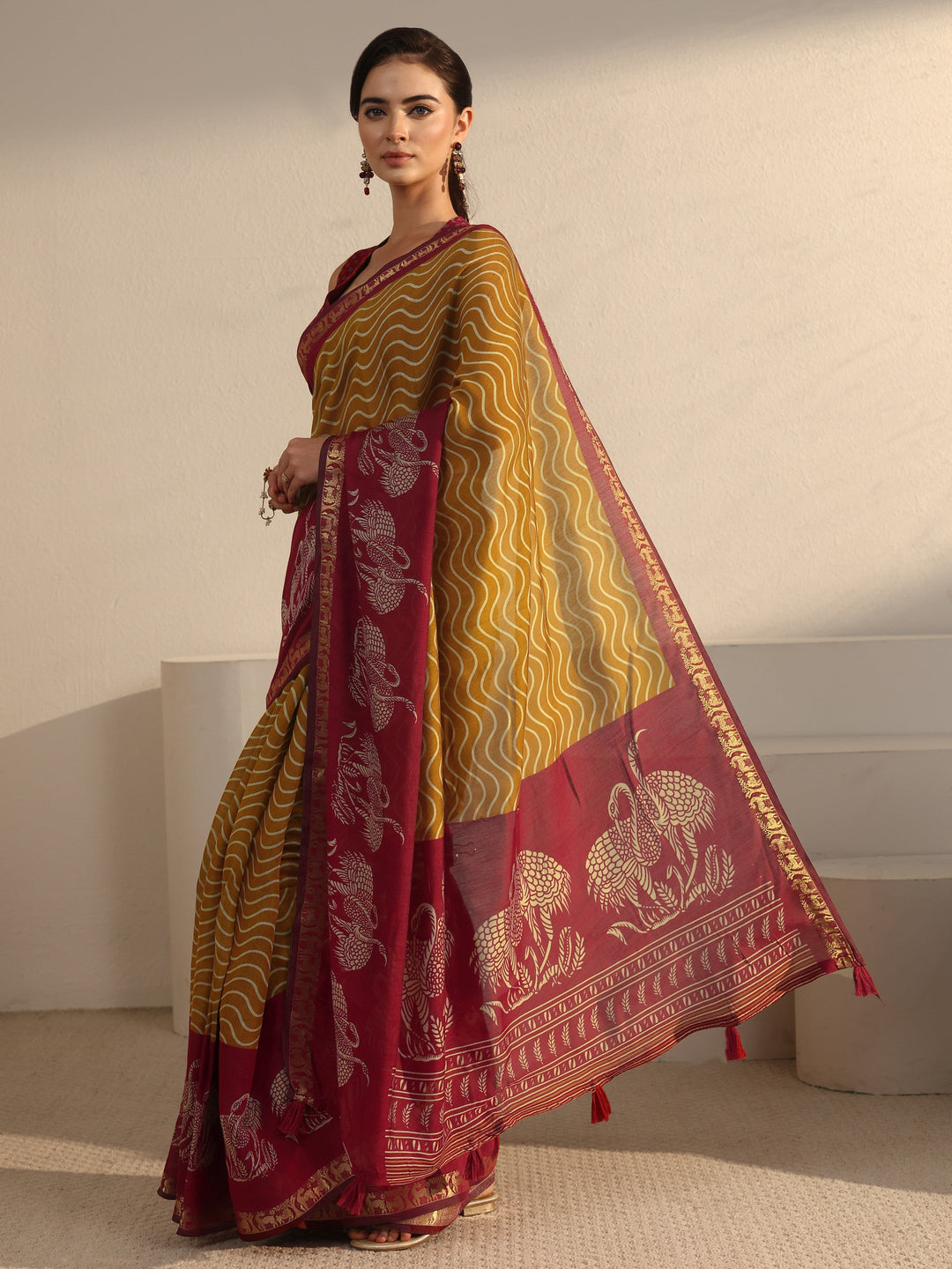 Libas Mustard and Red Wavy Stripe Printed Silk Blend Tassel Saree