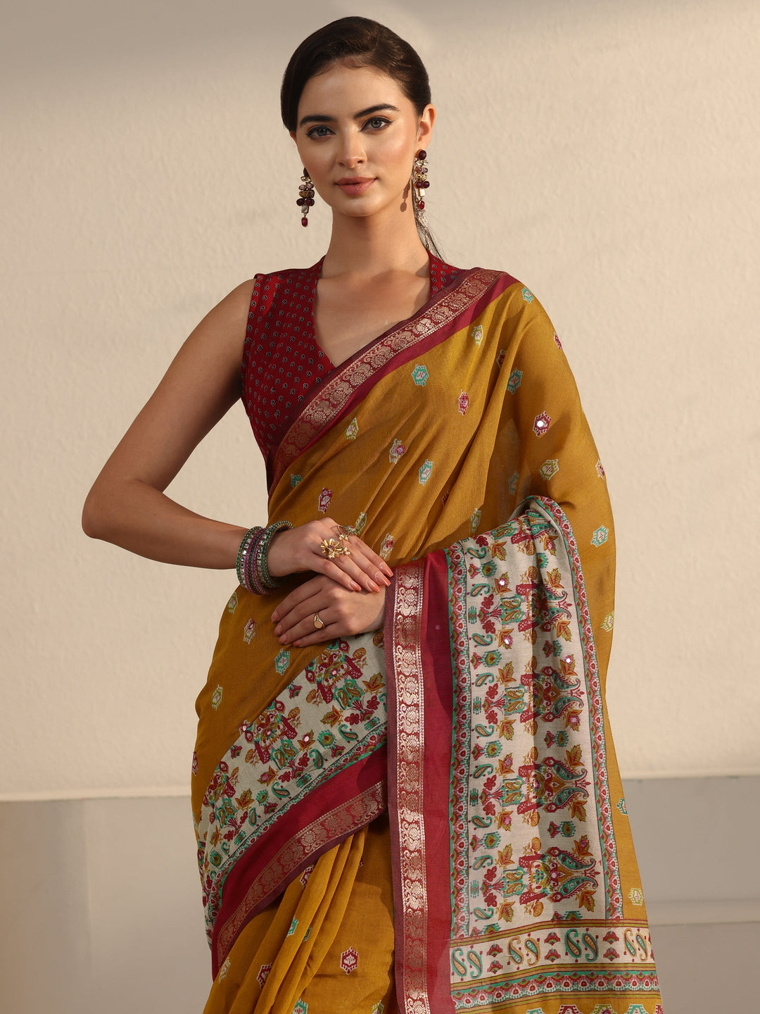 Libas Mustard and Red Printed Mirror Work Silk Blend Tassel Saree