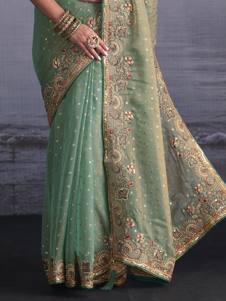 Libas Green Woven Design Tissue Saree with Embroidered Border