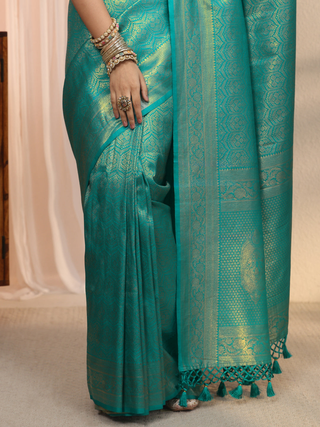 Libas Sea Green Woven Design Silk Blend Tassel Saree