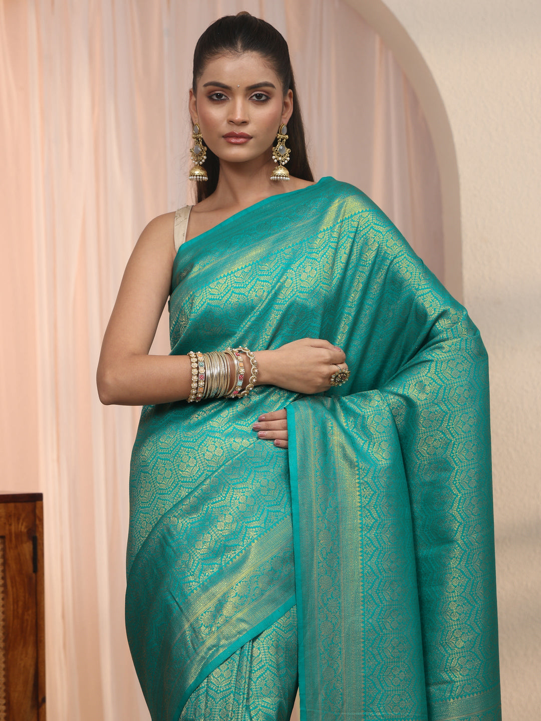 Libas Sea Green Woven Design Silk Blend Tassel Saree