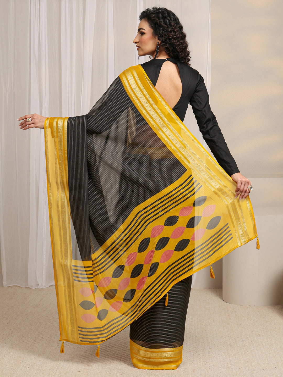 Black Printed Silk Blend Saree 
With Unstitched Blouse Piece