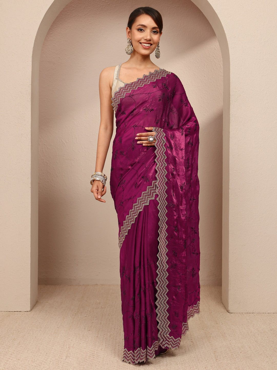 Magenta Embellished Silk Blend Saree
With Unstitched Blouse Piece