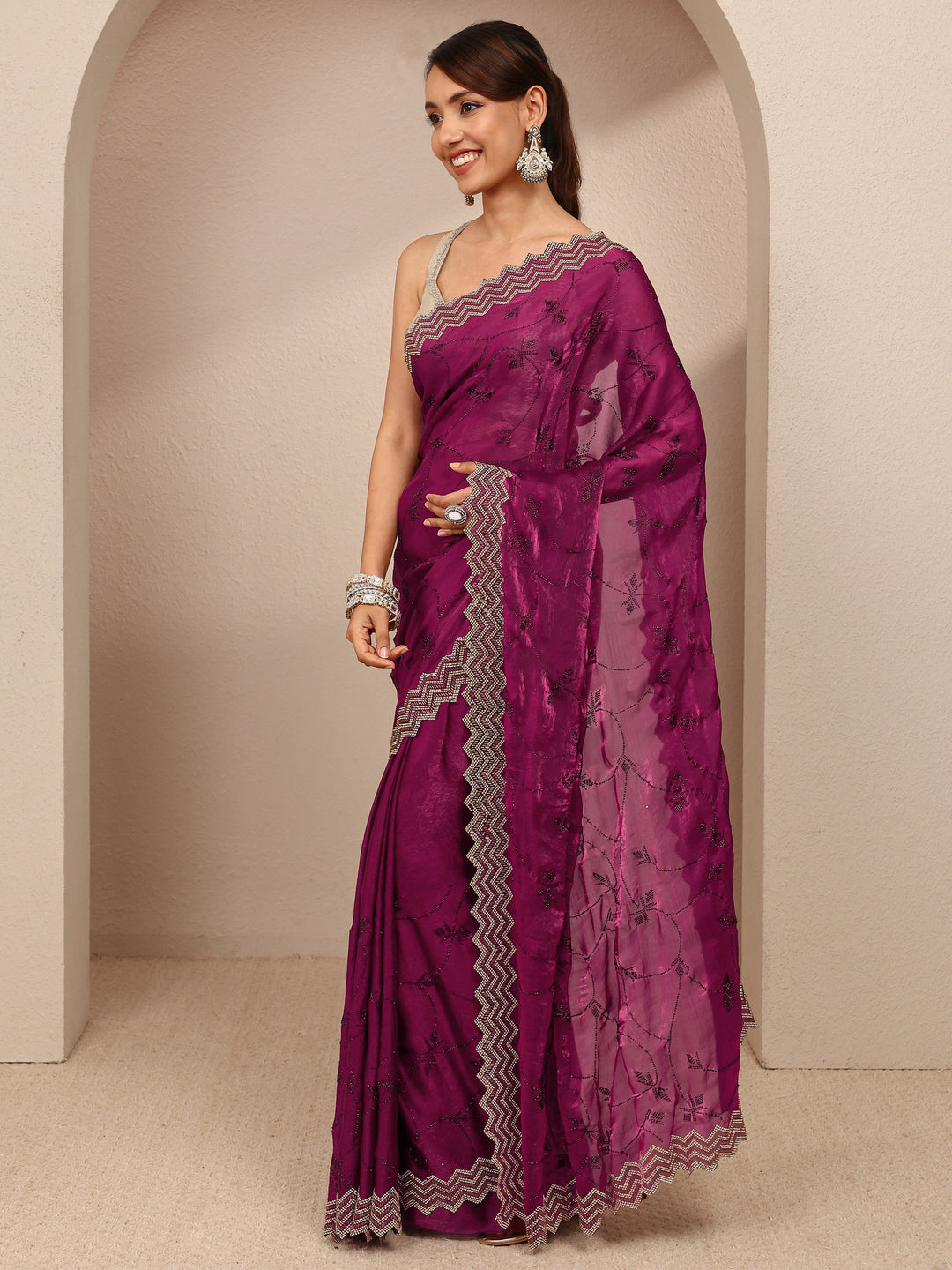 Magenta Embellished Silk Blend Saree
With Unstitched Blouse Piece