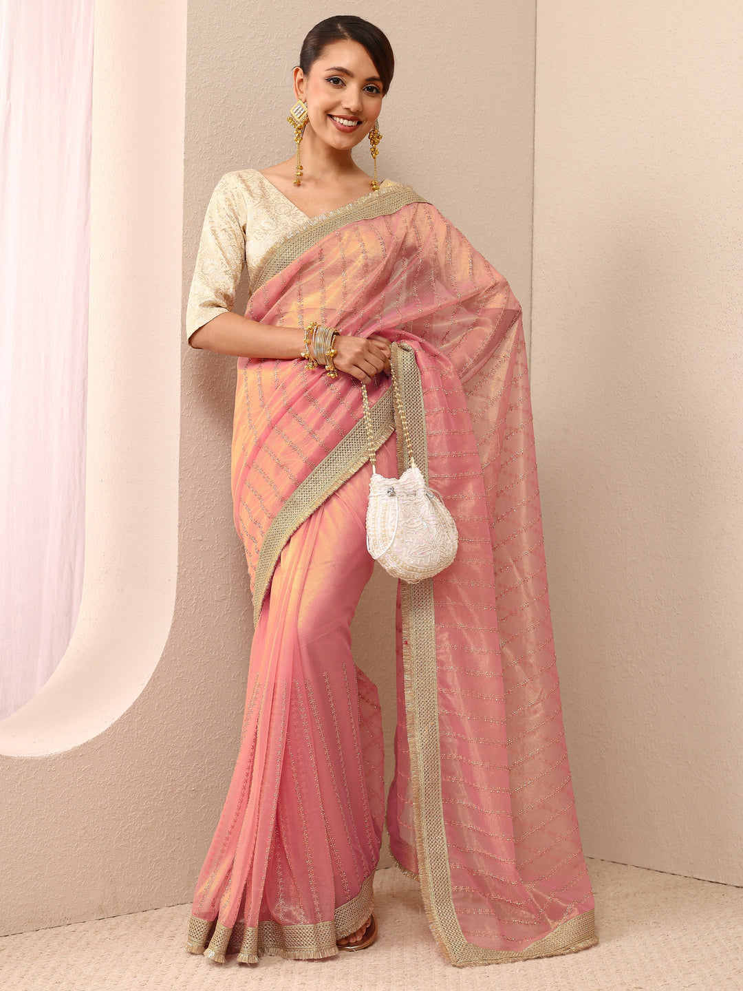 Pink Embellished Silk Blend Saree
With Unstitched Blouse Piece
