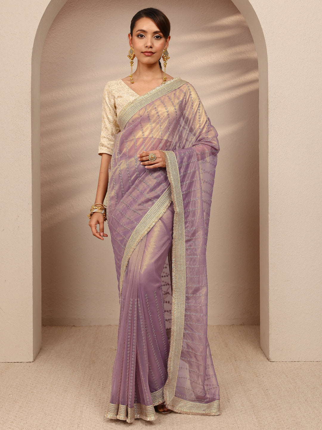 Lavender Embellished Silk Blend Saree
With Unstitched Blouse Piece