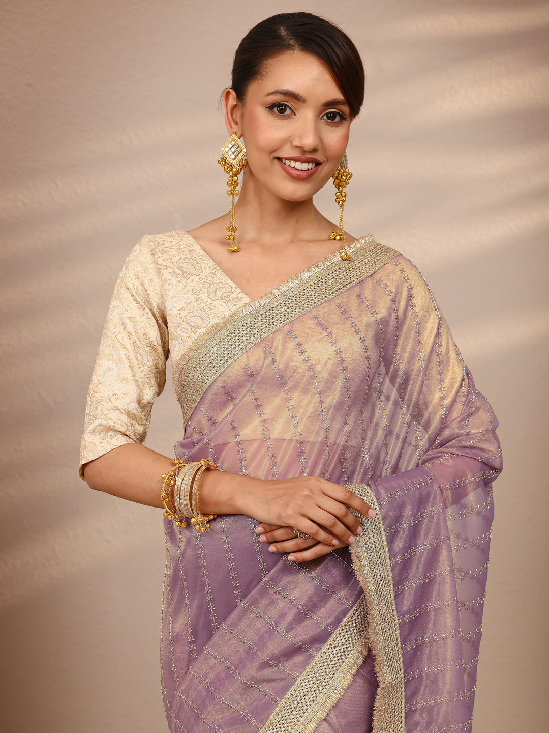 Lavender Embellished Silk Blend Saree
With Unstitched Blouse Piece