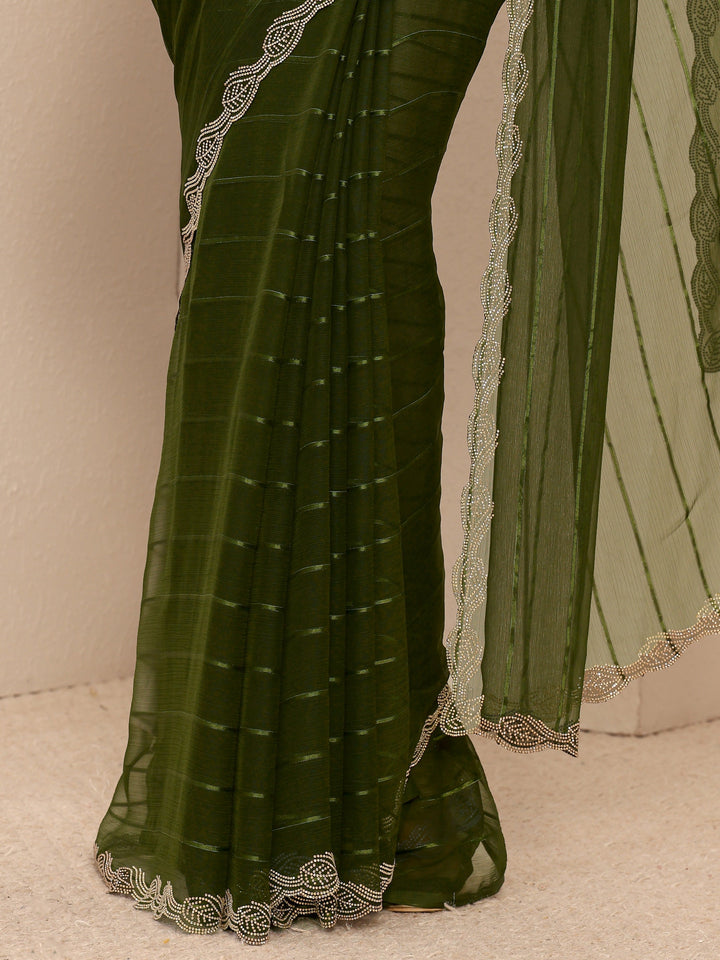 Green Striped Embellished Silk Blend Saree
With Unstitched Blouse Piece