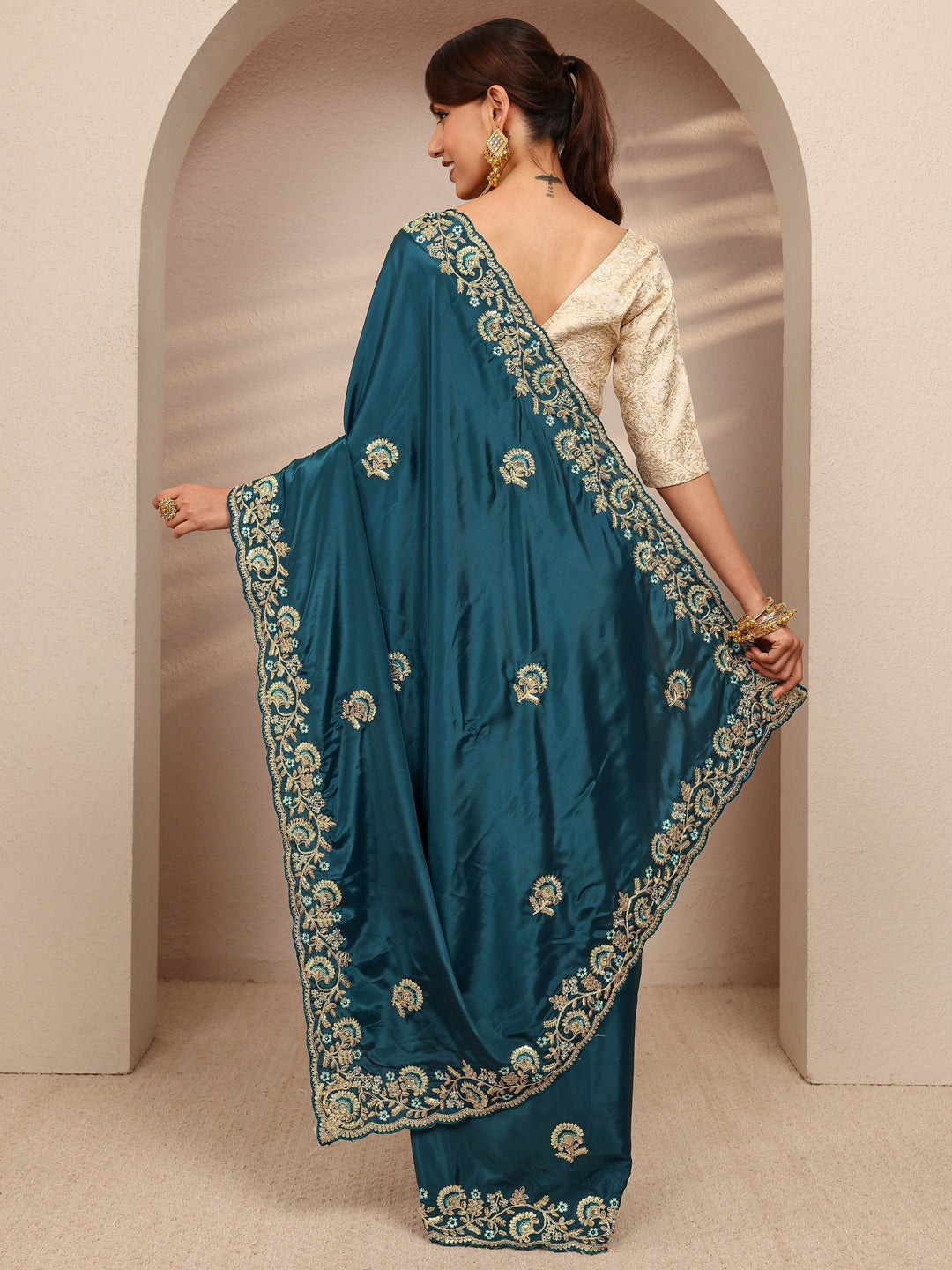 Teal Floral Embroidered Satin Saree
With Unstitched Blouse Piece