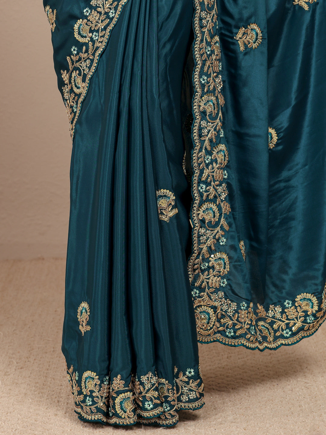 Teal Floral Embroidered Satin Saree
With Unstitched Blouse Piece