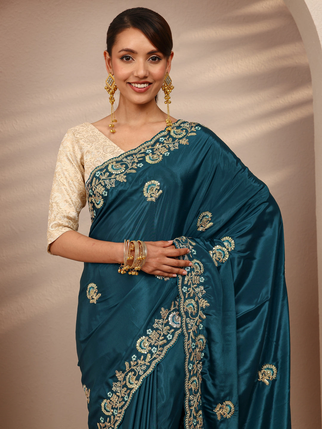 Teal Floral Embroidered Satin Saree
With Unstitched Blouse Piece