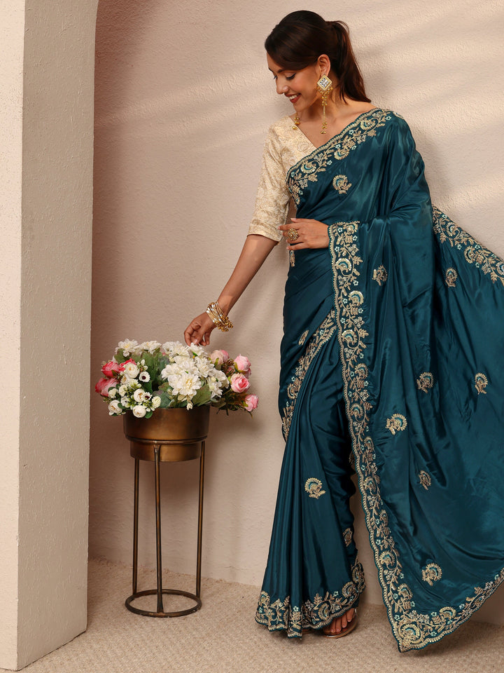 Teal Floral Embroidered Satin Saree
With Unstitched Blouse Piece