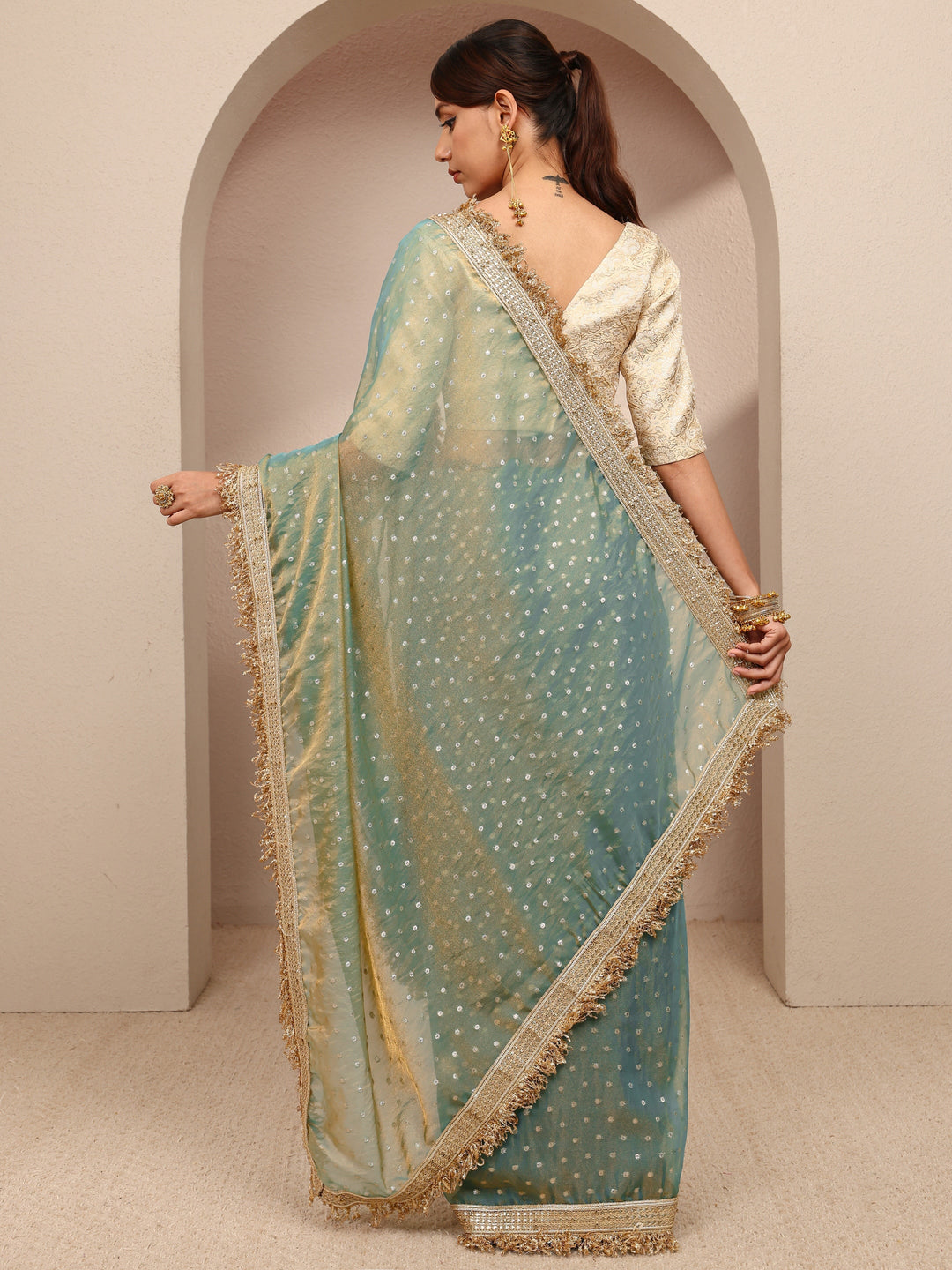 Green Woven Design Tissue Saree
With Unstitched Blouse Piece