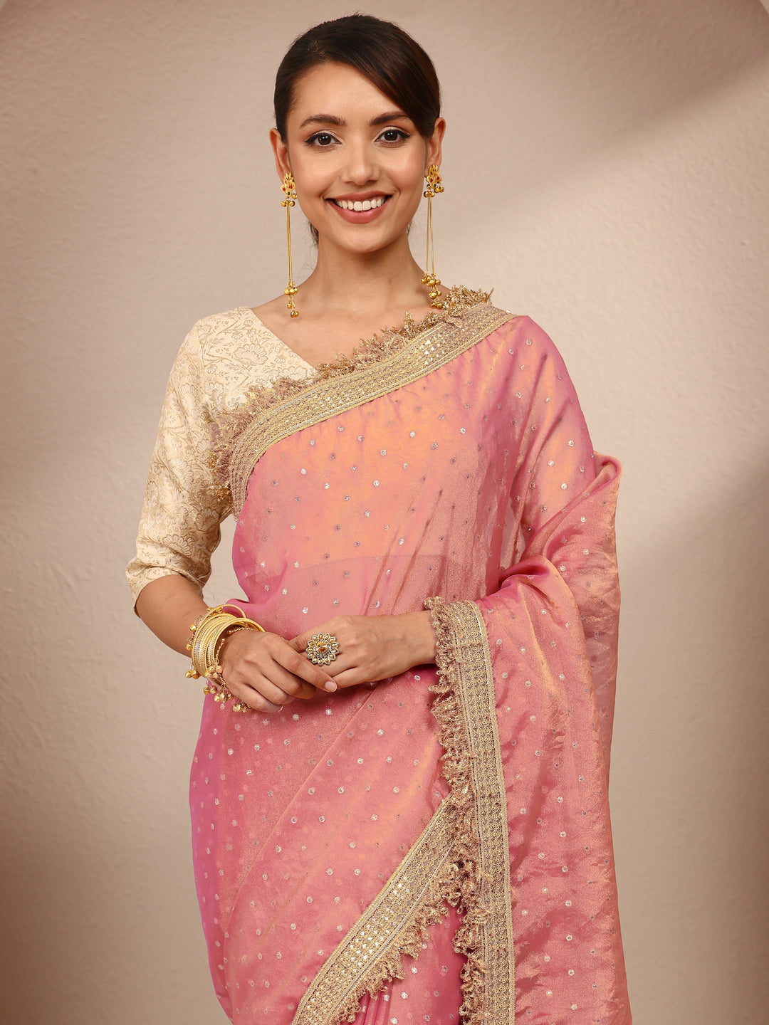Pink Woven Design Tissue Saree
With Unstitched Blouse Piece