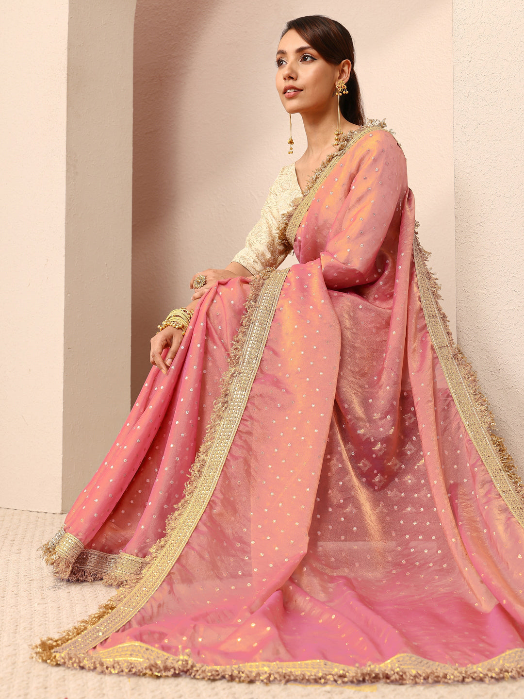 Pink Woven Design Tissue Saree
With Unstitched Blouse Piece