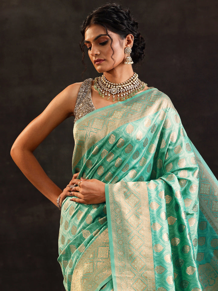 Sea Green Woven Design Silk Blend Saree With Unstitched Blouse Piece