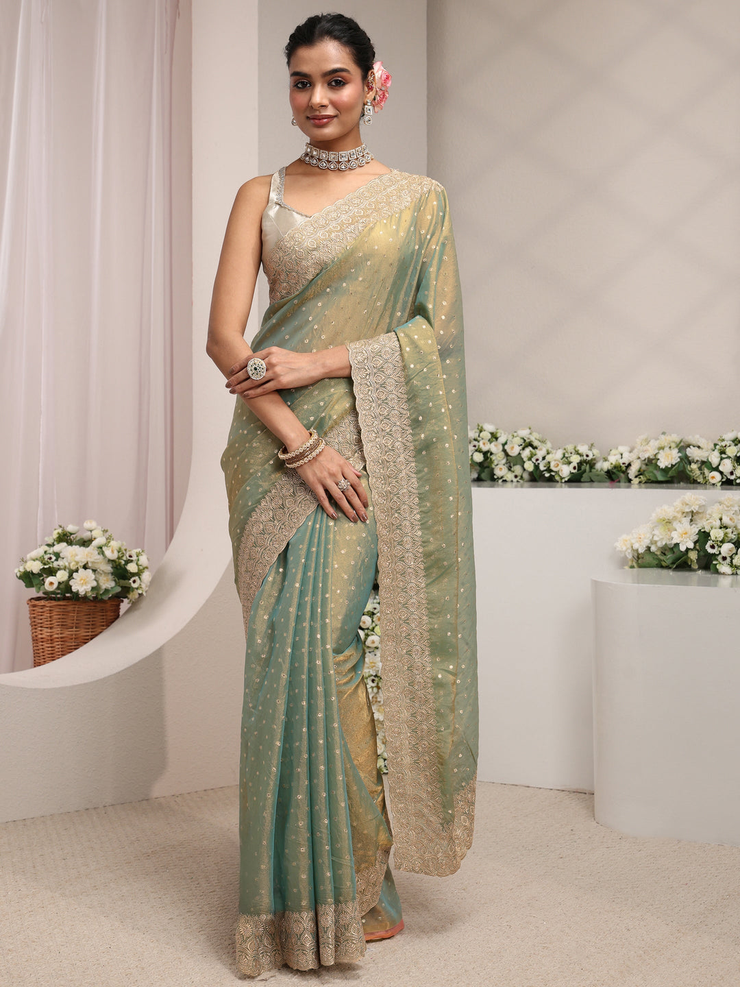 Green Woven Design Tissue Saree With Unstitched Blouse Piece
