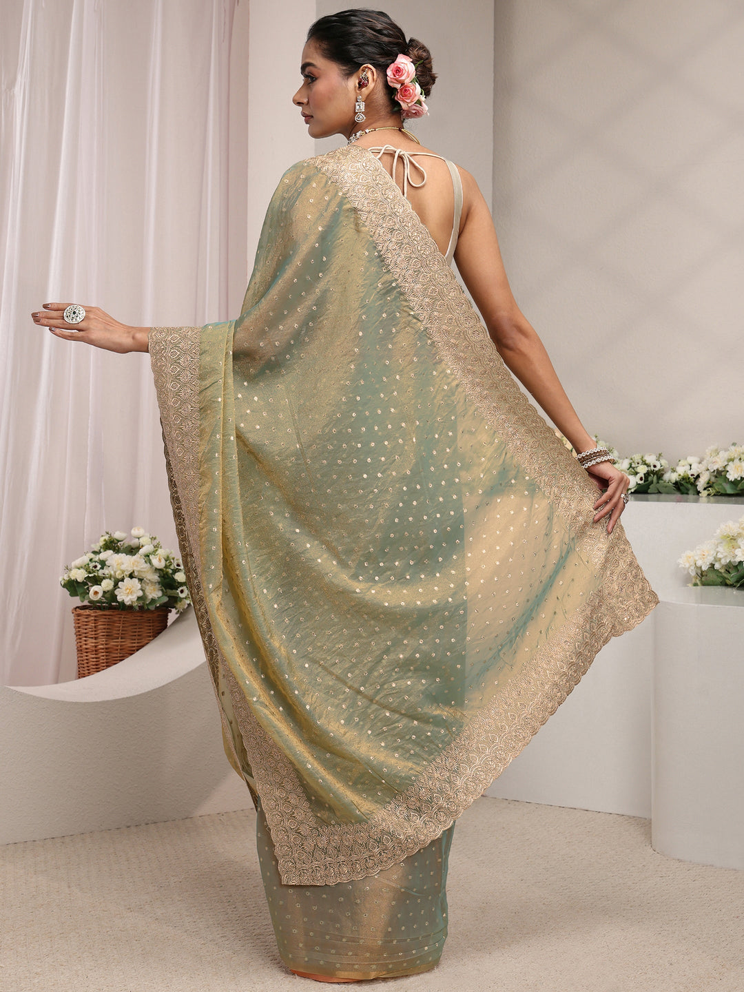 Green Woven Design Tissue Saree With Unstitched Blouse Piece