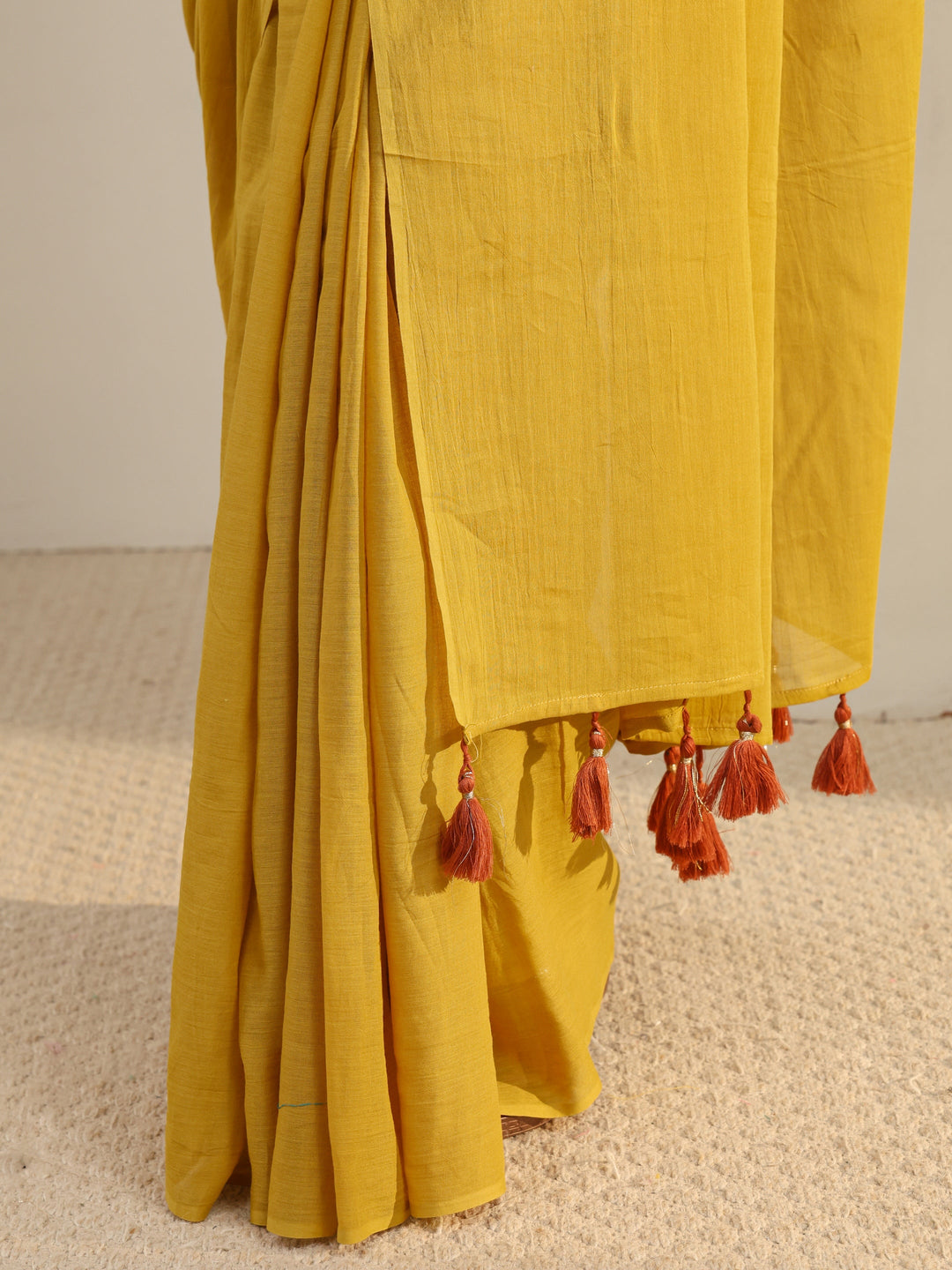 Mustard Solid Cotton Tassel Saree With Unstitched Blouse Piece