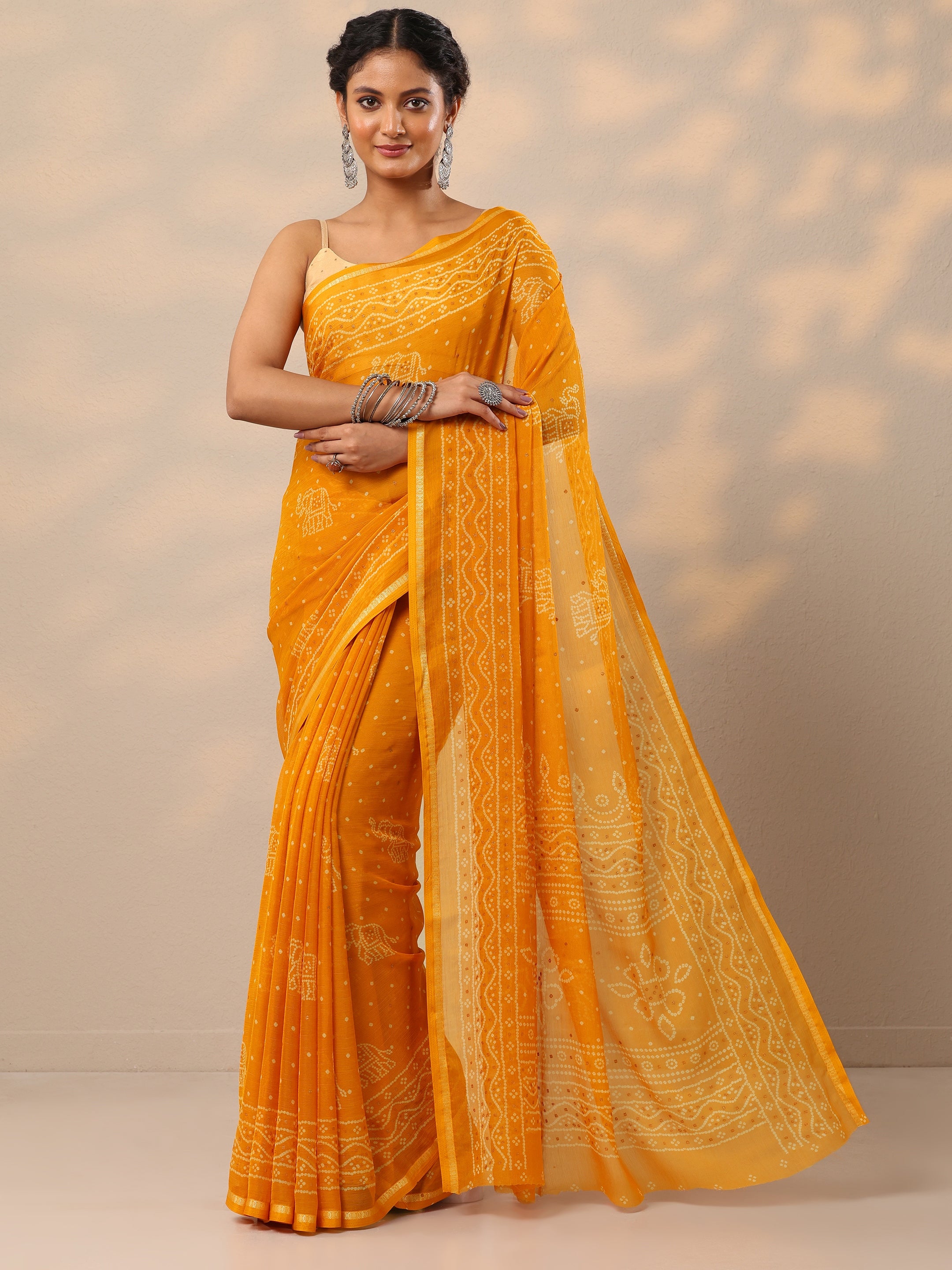Buy Mustard Bandhani Printed Chiffon Saree With Unstitched