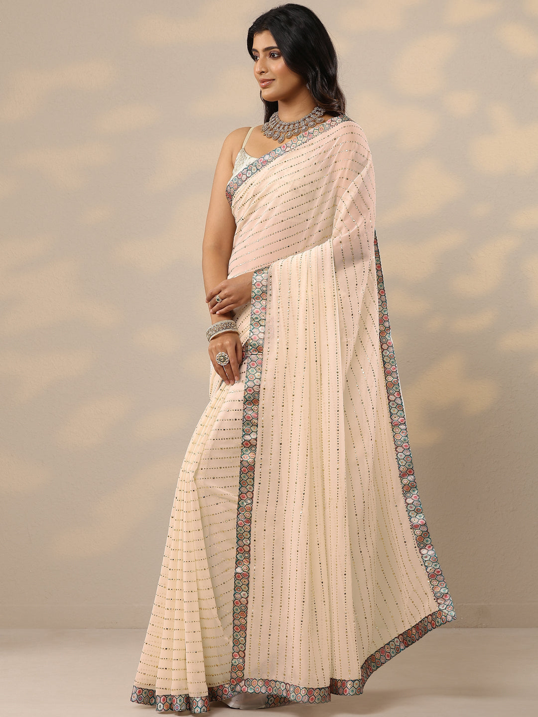 Cream Embellished Georgette Sarees With Unstitched Blouse Piece