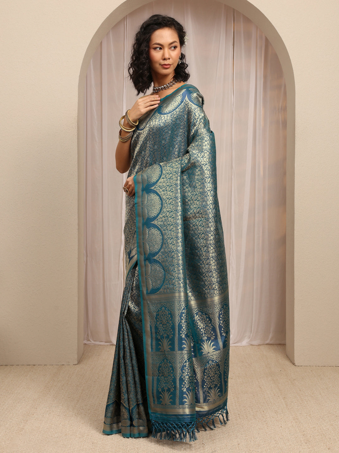 Teal Woven Design Silk Blend Saree With Unstitched Blouse Piece
