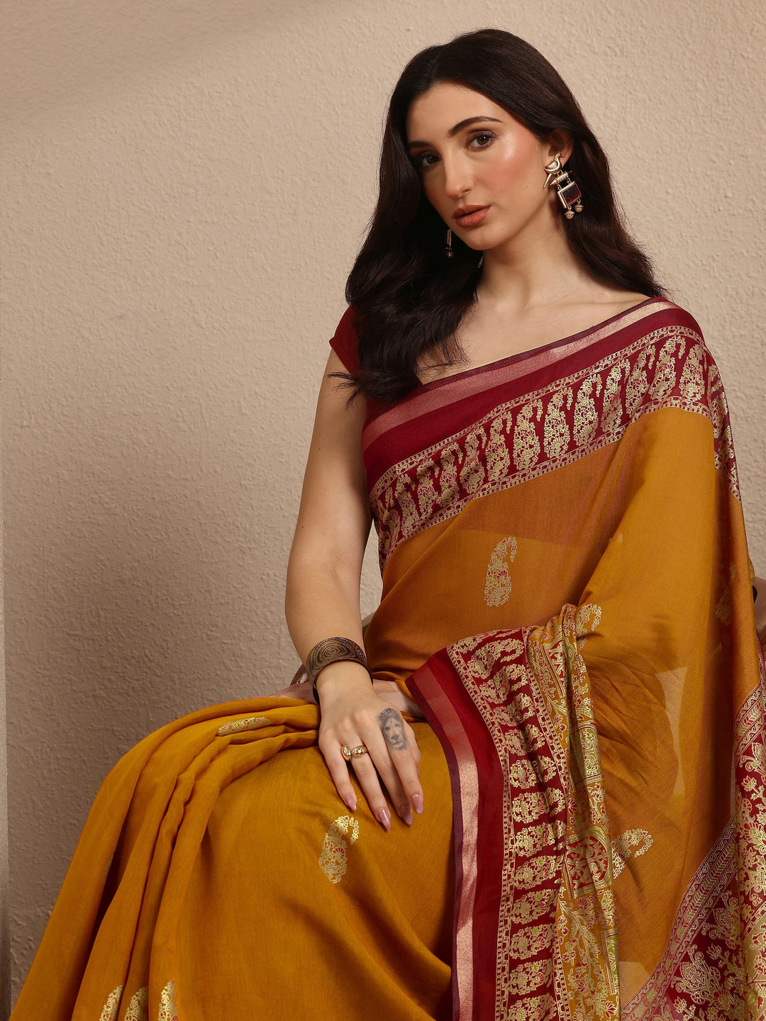 Mustard Paisley Woven Design Banarsi Silk Blend Saree With Unstitched Blouse Piece