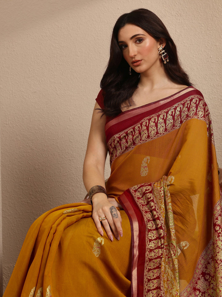 Mustard Paisley Woven Design Banarsi Silk Blend Saree With Unstitched Blouse Piece