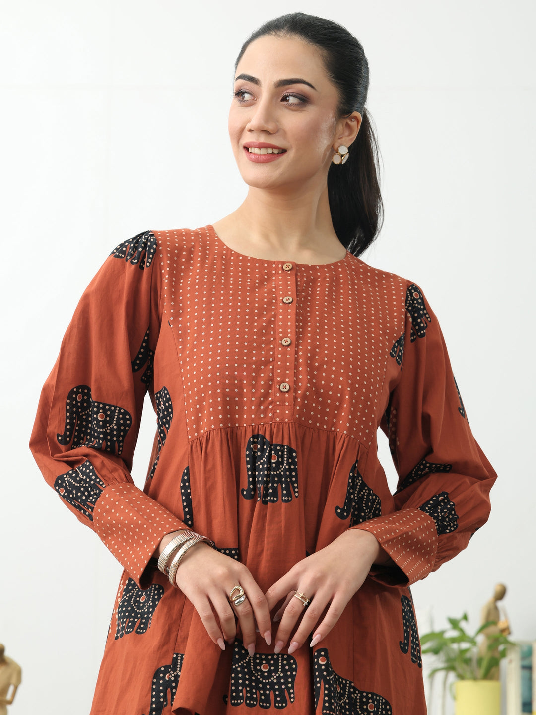 Rust Tribal Printed Cotton Blend A-Line Short Kurti
