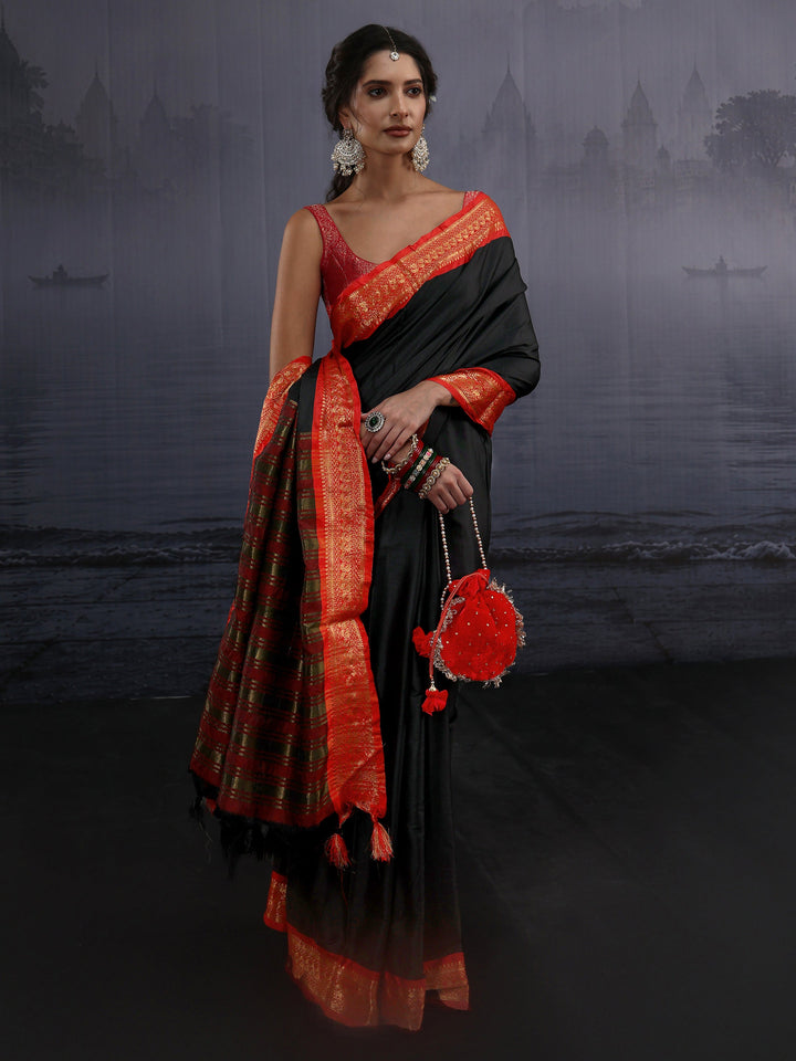 Libas Black and Orange Silk Blend Tassel Saree with Woven Border