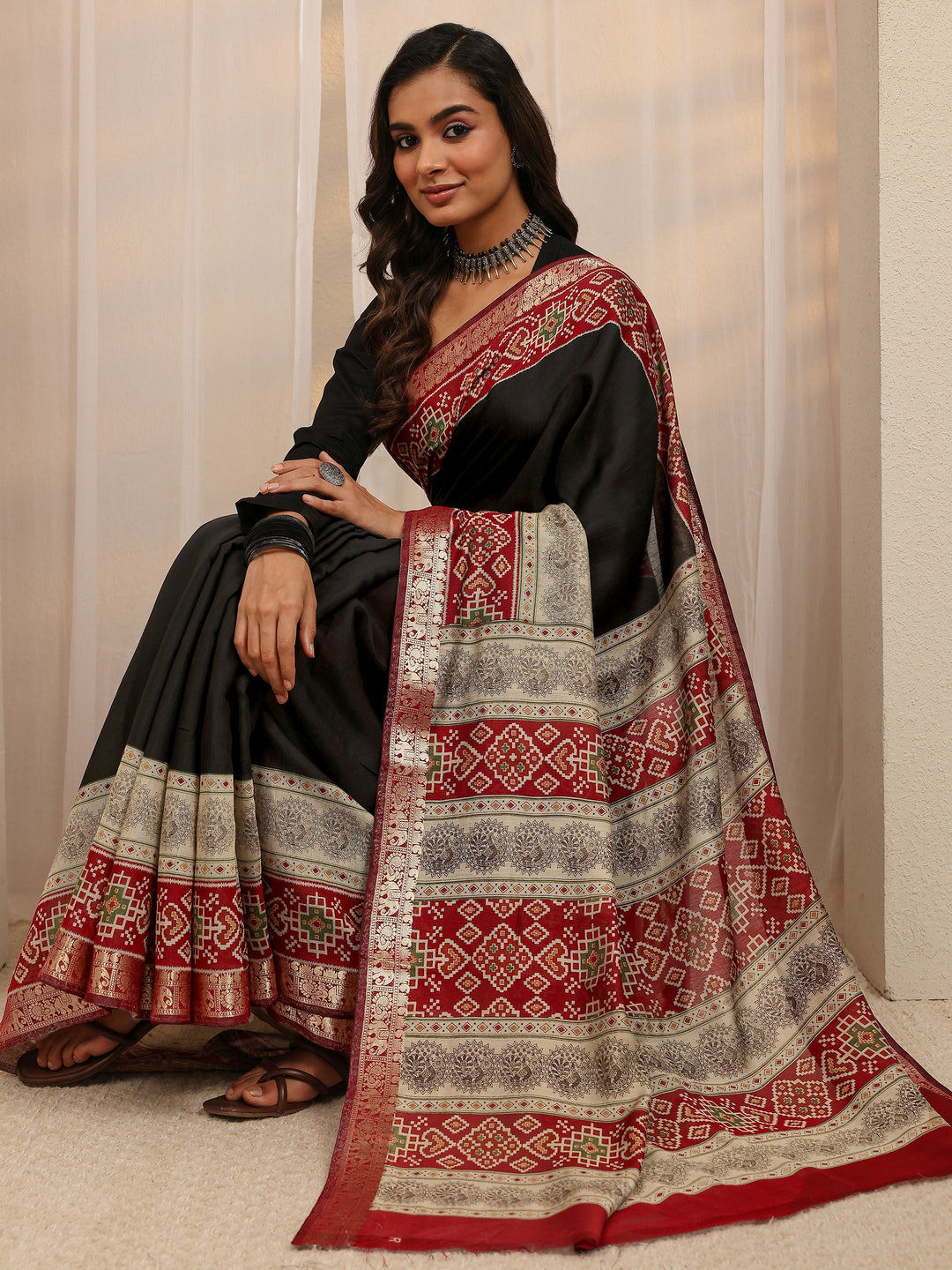 Black Ethnic Motif Silk Blend Saree 
With Unstitched Blouse Piece