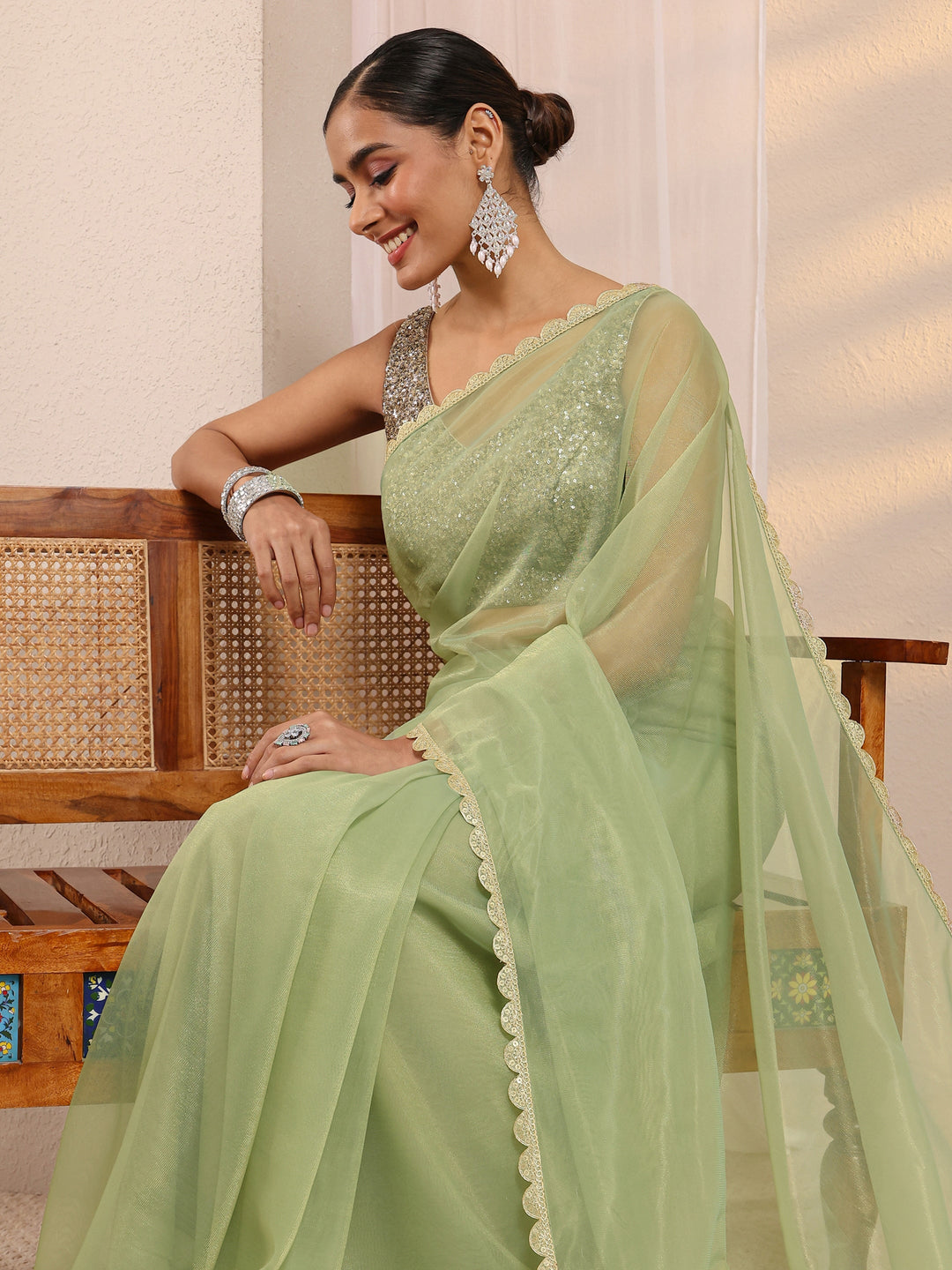 Green Embellished Sheen Net Saree 
With Unstitched Blouse Piece