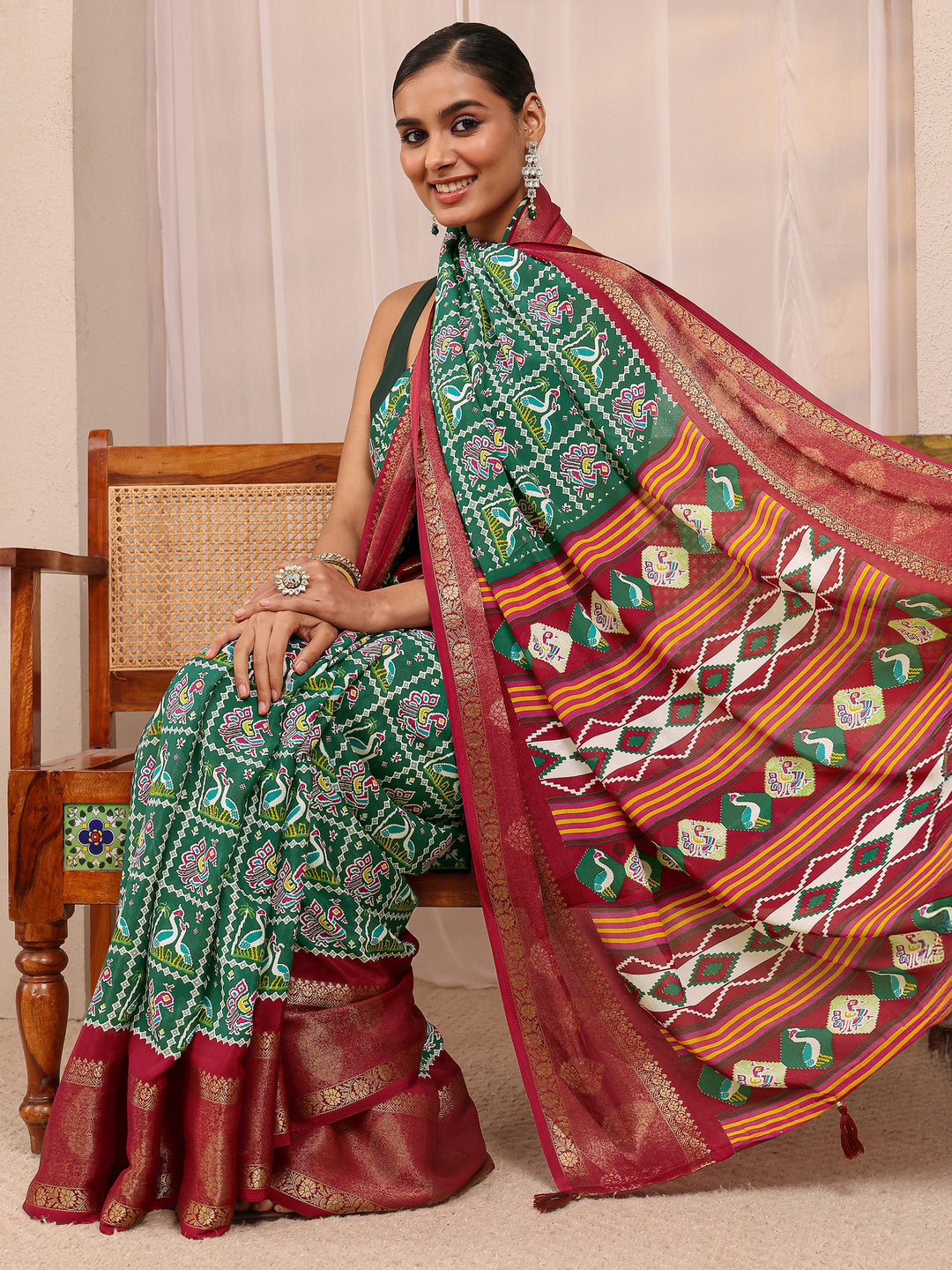 Green Patola Printed Silk Blend Saree 
With Unstitched Blouse Piece