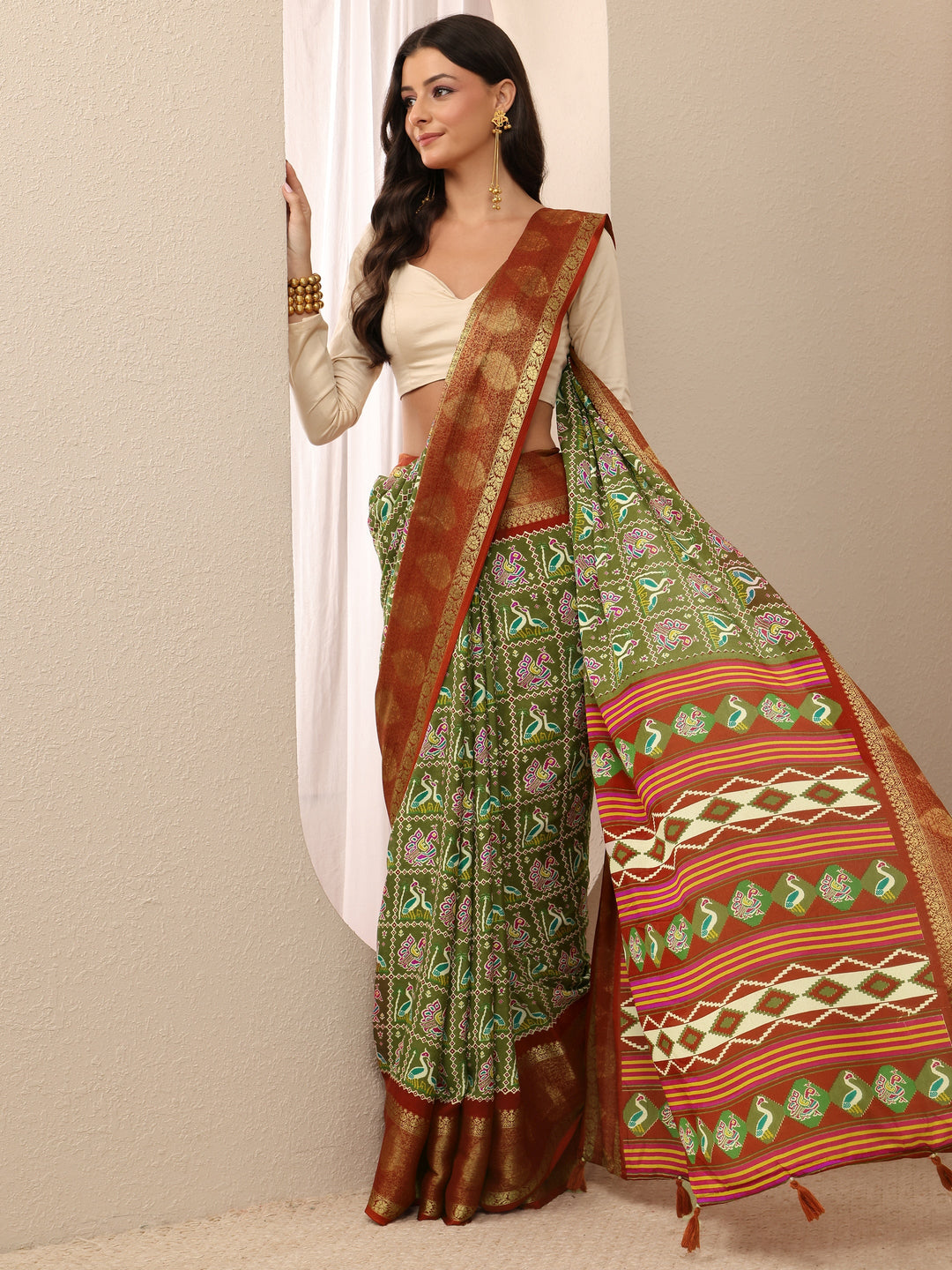 Green Patola Silk Blend Saree 
With Unstitched Blouse Piece