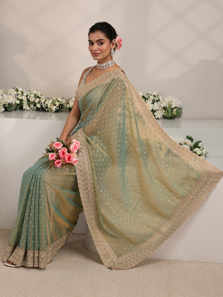 Green Woven Design Tissue Saree With Unstitched Blouse Piece